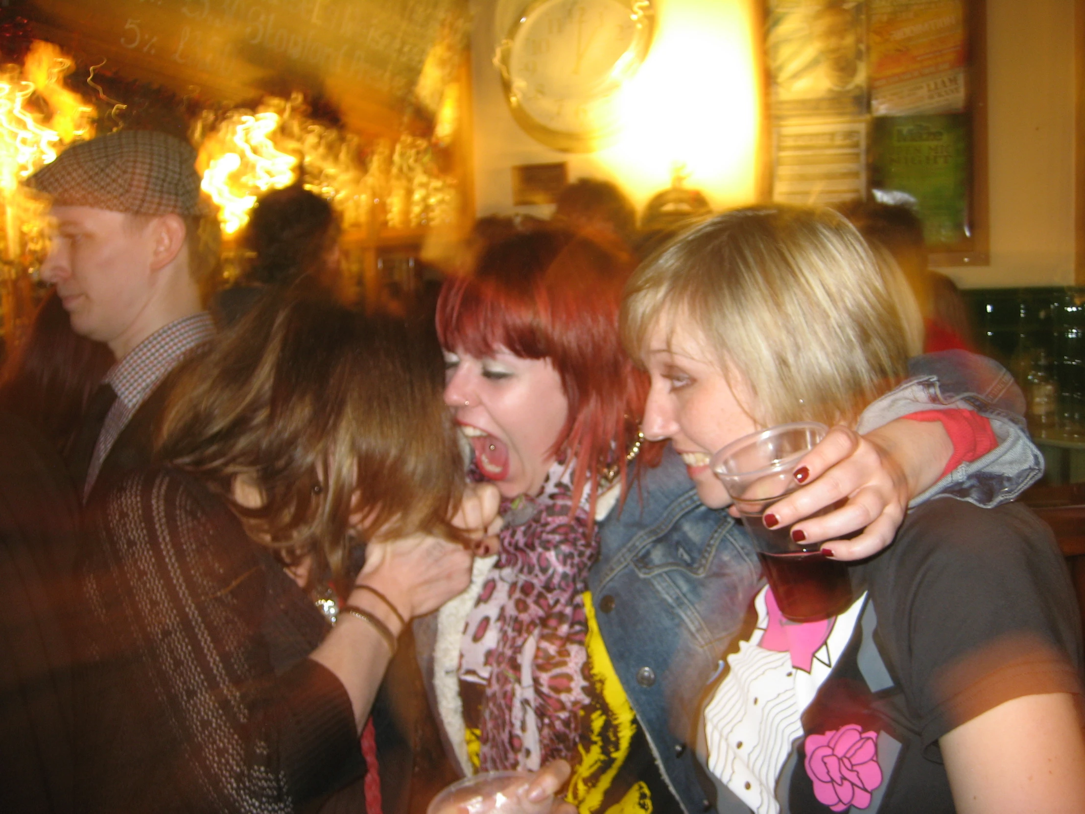 three women are trying to get into a crowd