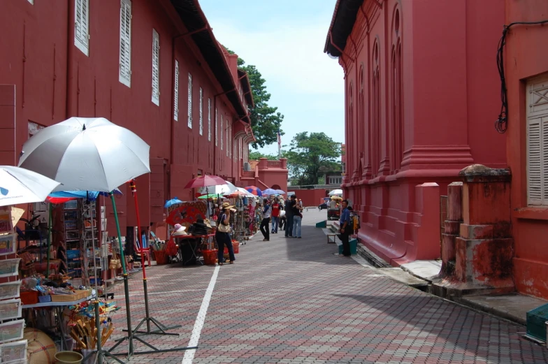 several vendors are lined up next to a building