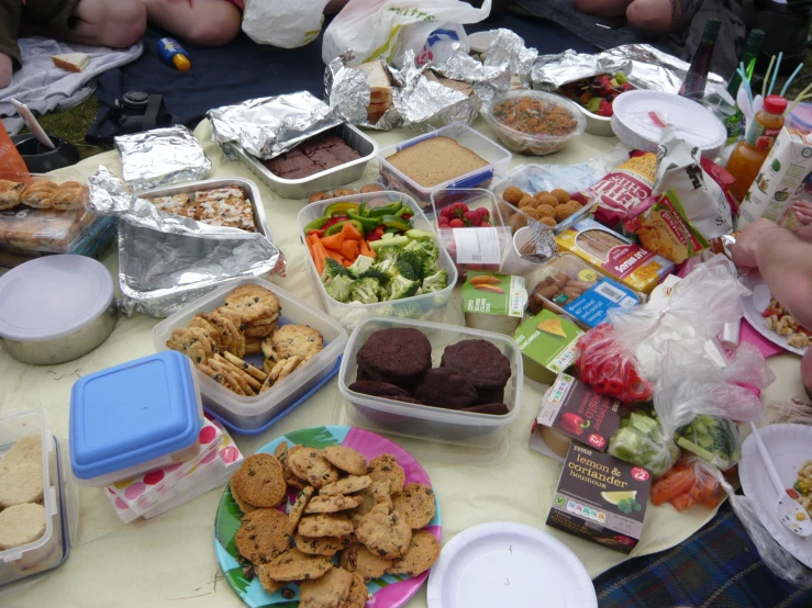 food spread out on a table at a picnic