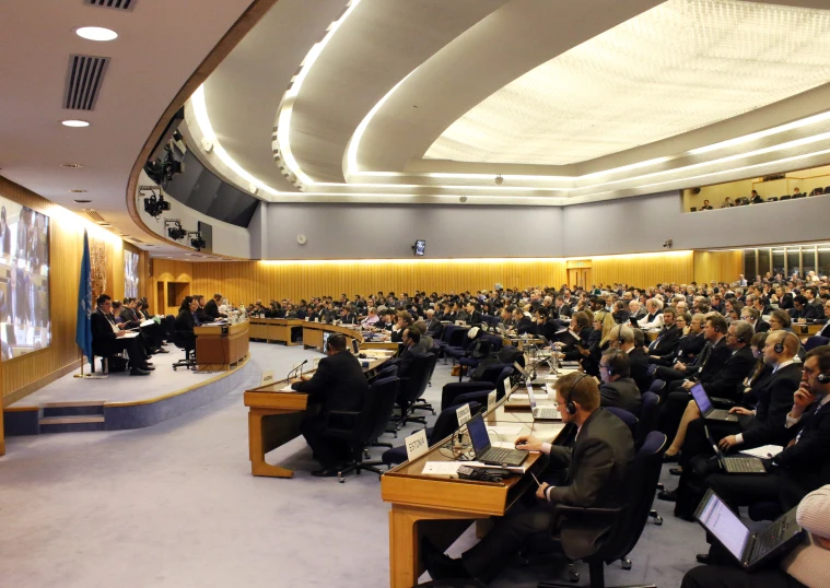 a crowd of people in a conference hall