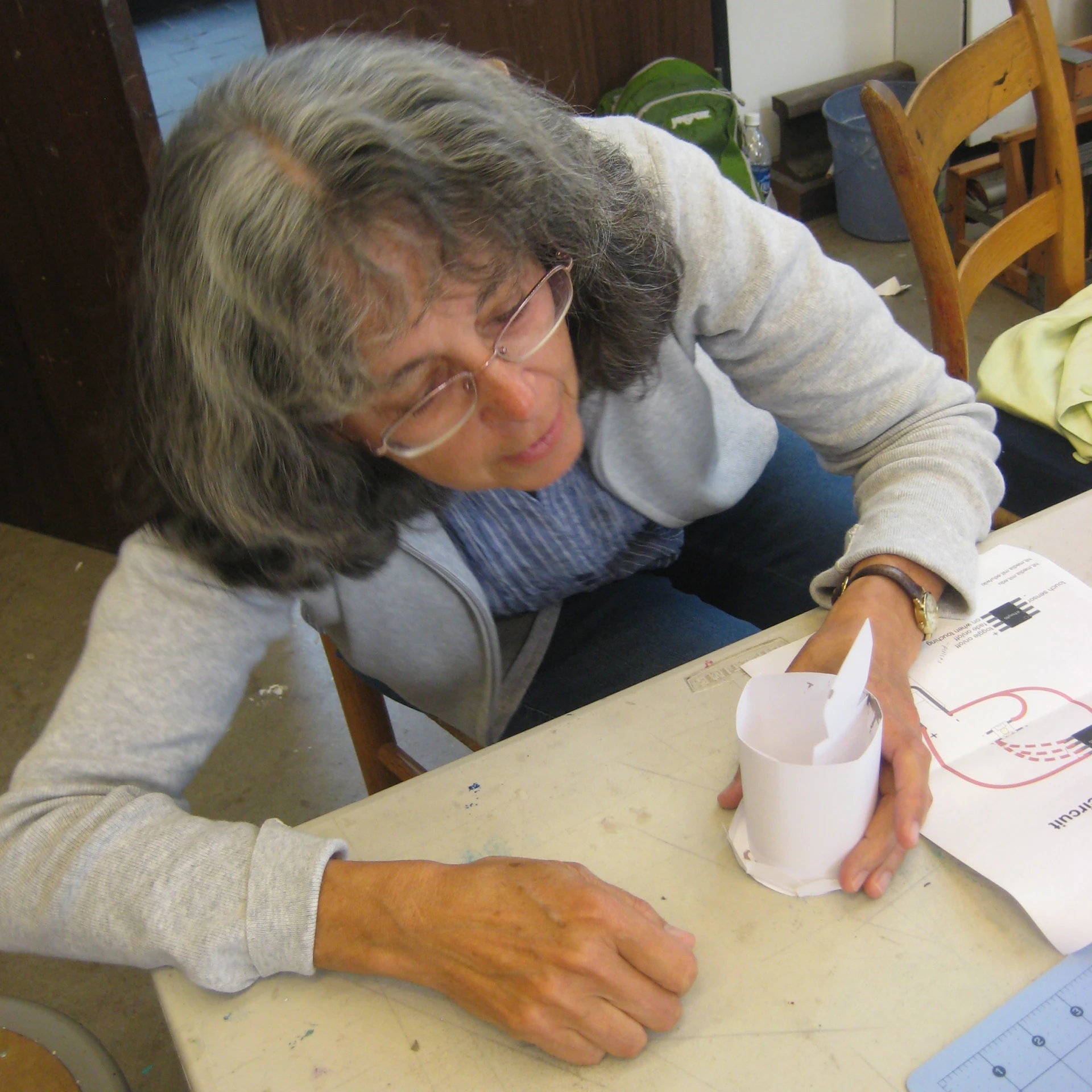 woman doing some arts and crafts at the table