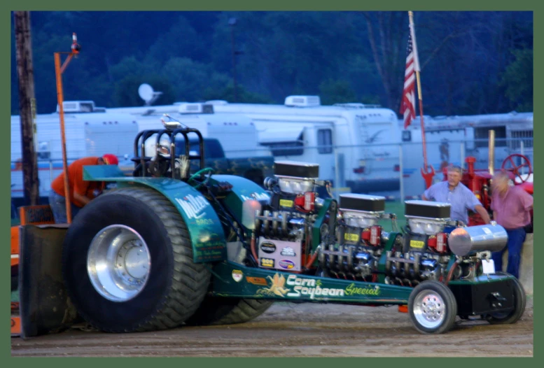 a big truck with multiple engines is parked in a parking lot