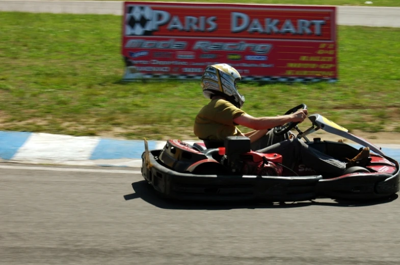 a man that is sitting in an kart race