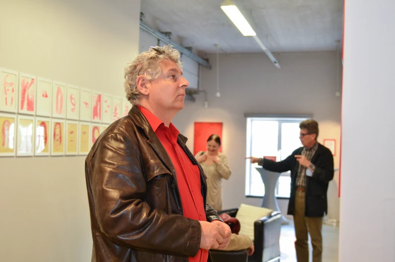 two men standing in an office talking