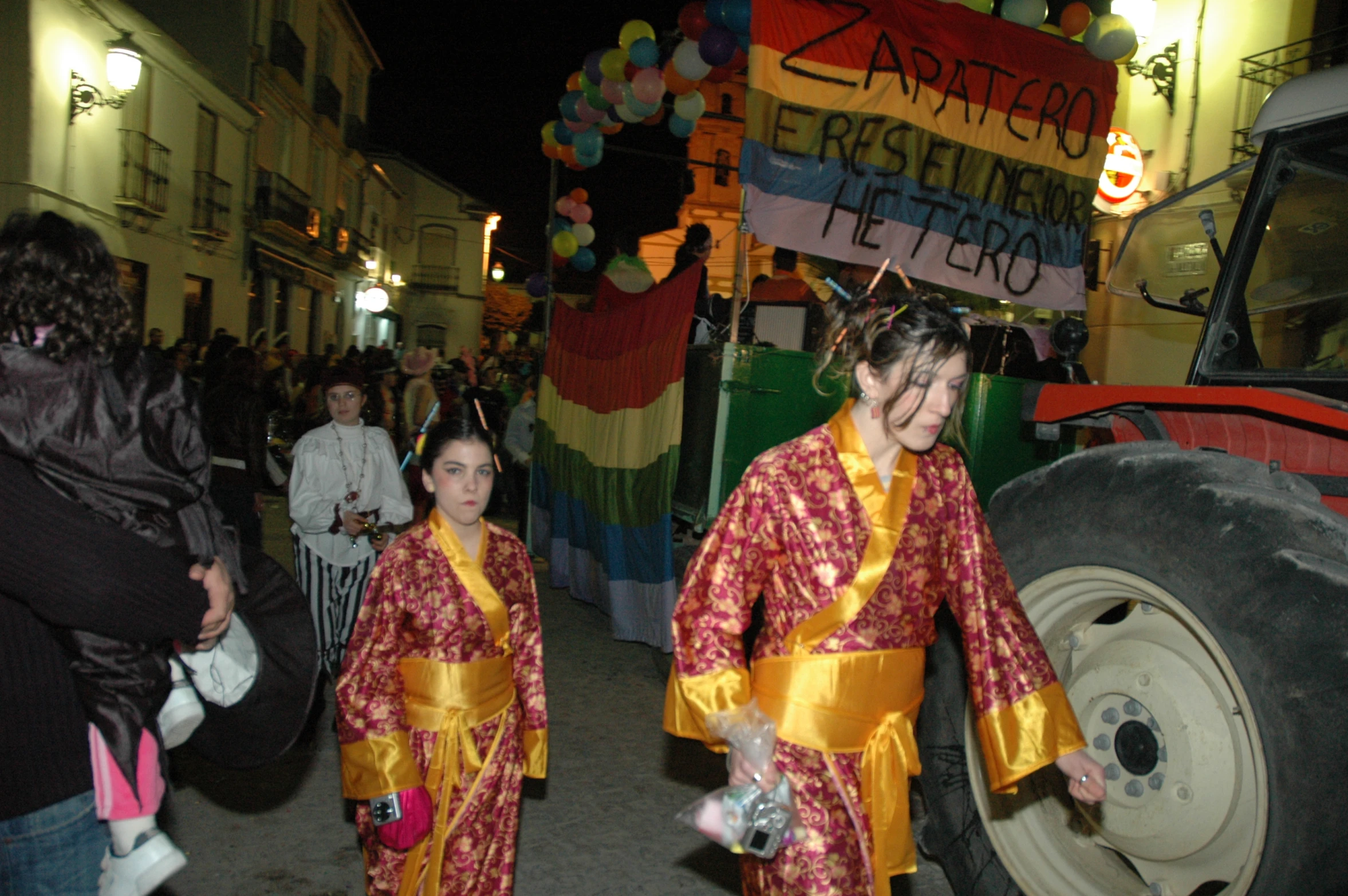 two women in costume walking down the street