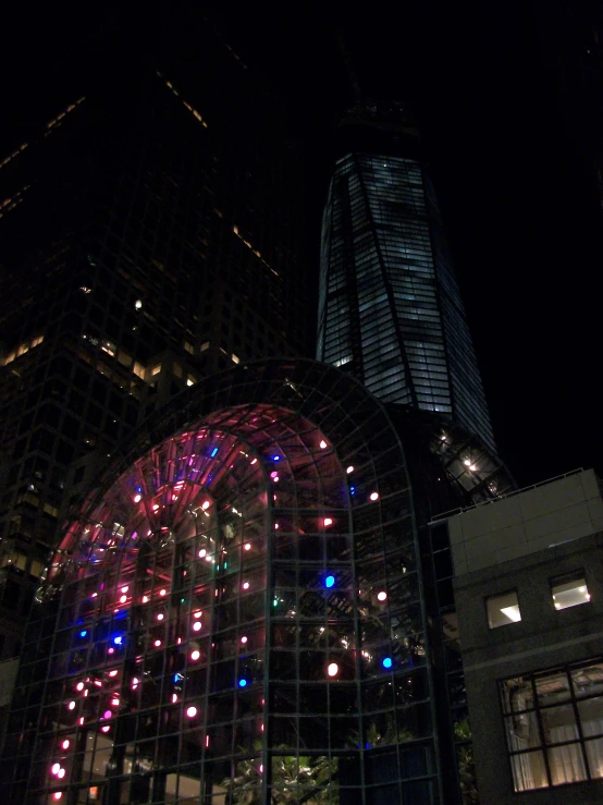 an image of a city at night with colorful lights