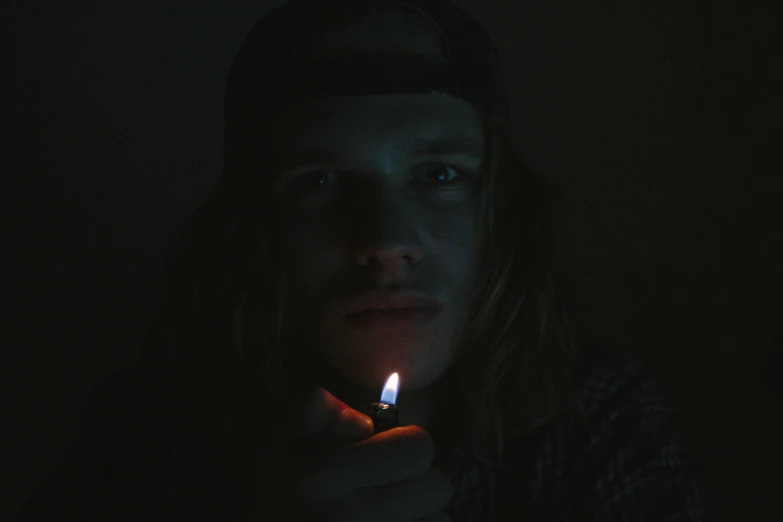 a man holding a lighter in his hands