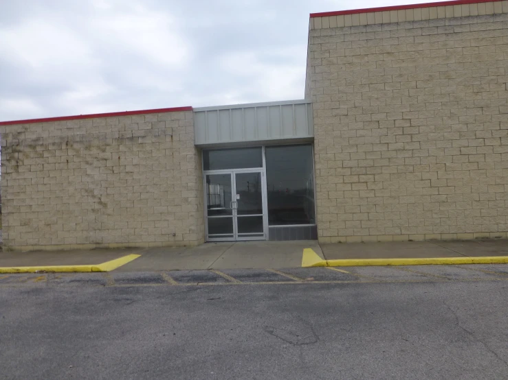 an empty parking lot in front of a building