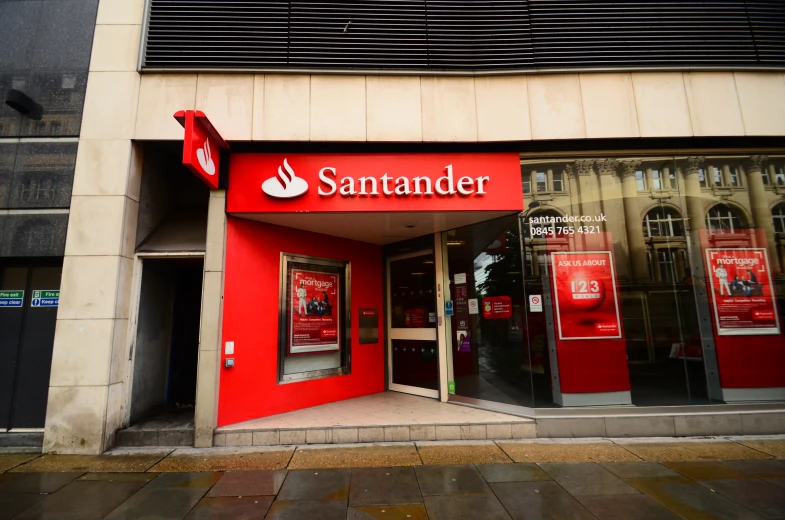 a red door to a store that says sander on the front