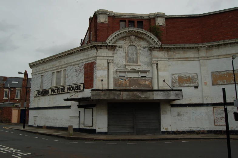 an old building with a sign on it's corner