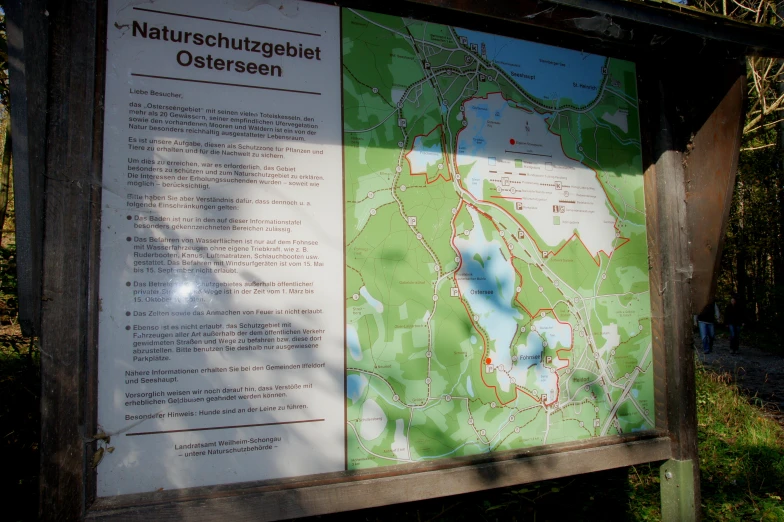 the map is on display in front of the sign