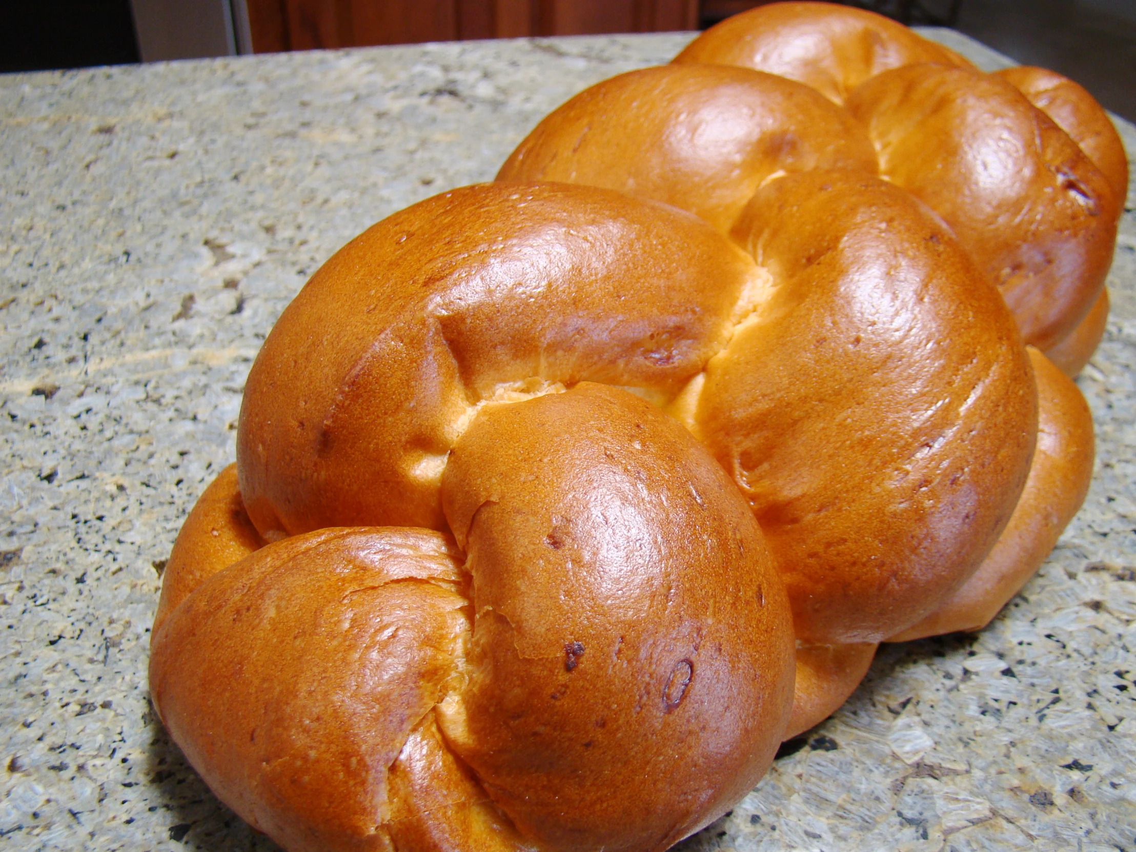 a pile of buns that are on top of a counter