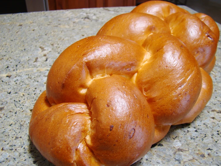 a pile of buns that are on top of a counter