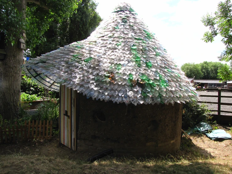 a hut made out of glass bottle caps