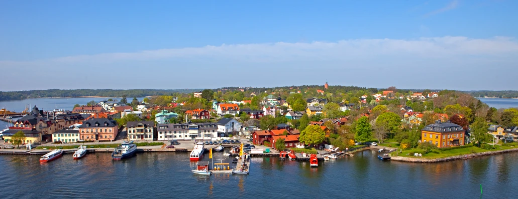 a harbor filled with lots of boats near colorful buildings