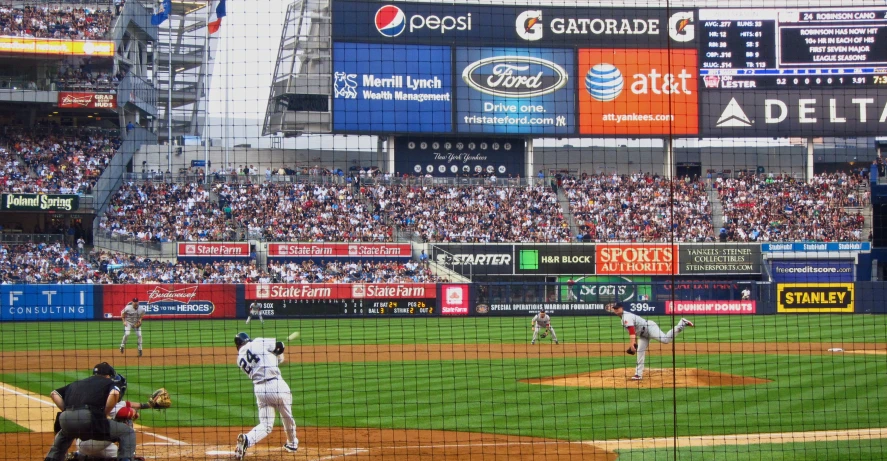 a baseball game in progress with a huge crowd watching