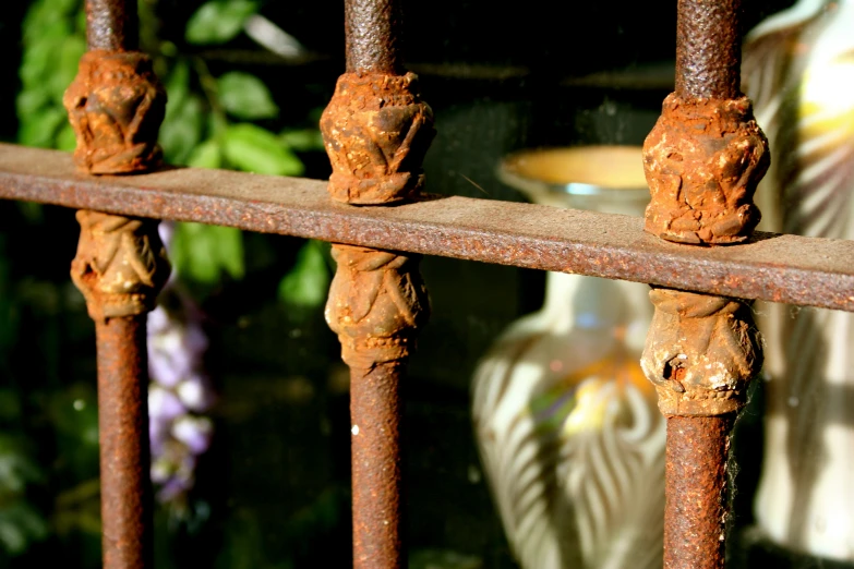 rusty railing with metal posts covered with rust