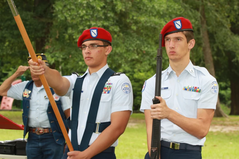 two boys holding guns in their hands are ready to shoot