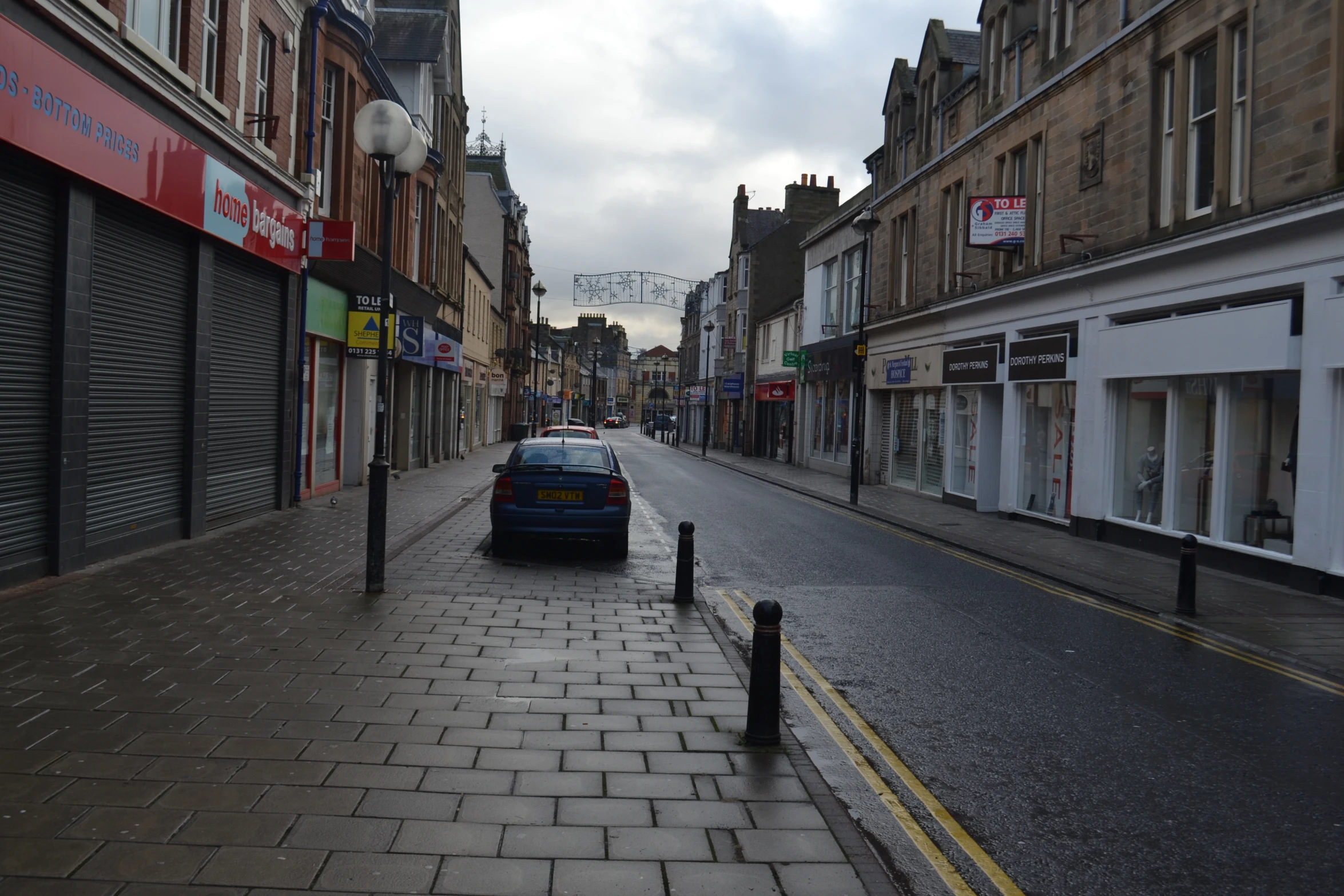 a car is parked in the middle of a street