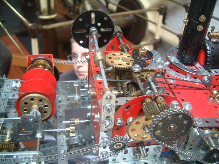 a man looking over an elaborately designed machine