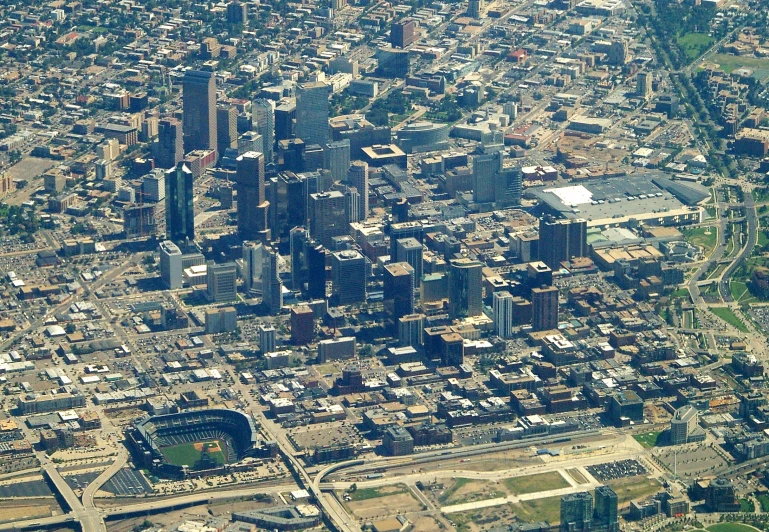 an aerial view of a city with lots of tall buildings