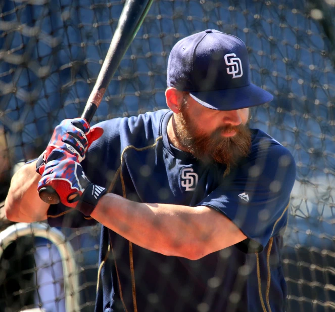 a man taking a swing at a baseball