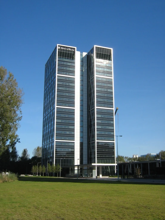 a large tall building on the green grass