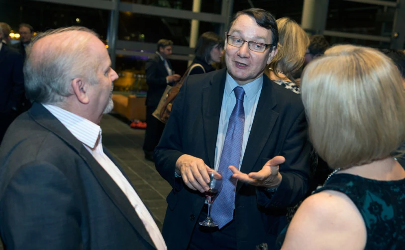 man talking to other people in a room