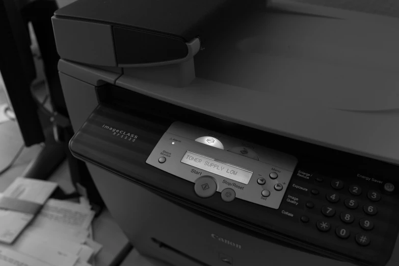 a printer sitting on top of an office desk