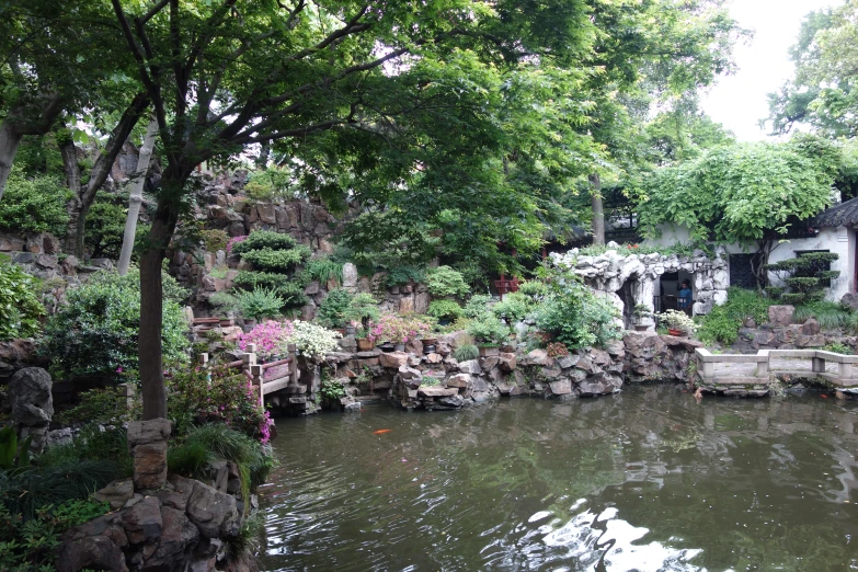 a lake surrounded by trees next to a park