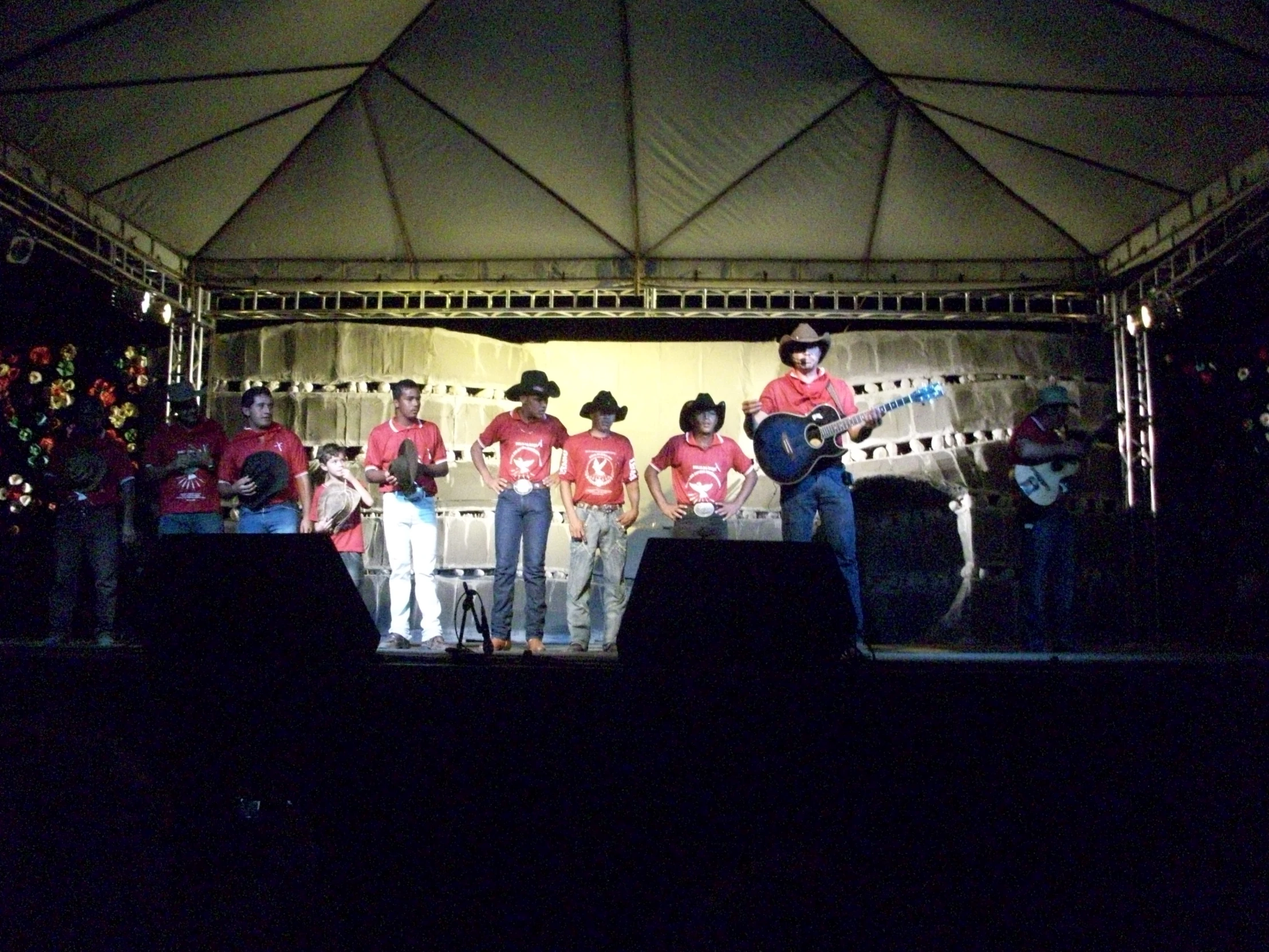 a group of men on stage with instruments