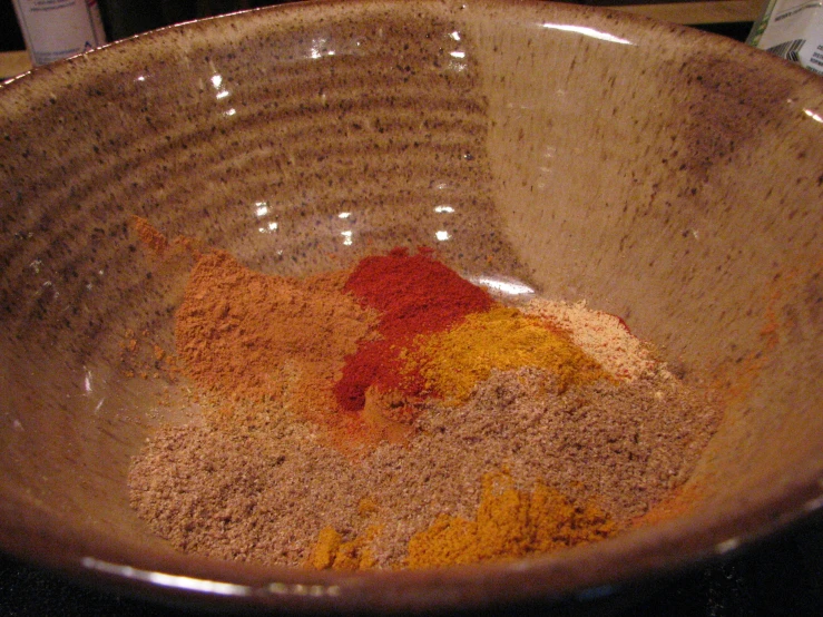 a bowl with spices and flour in it