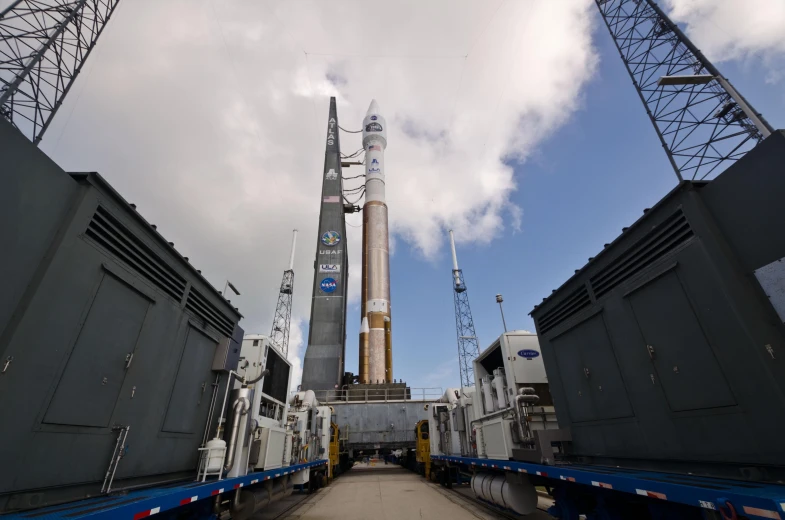 a truck is driving past a giant structure