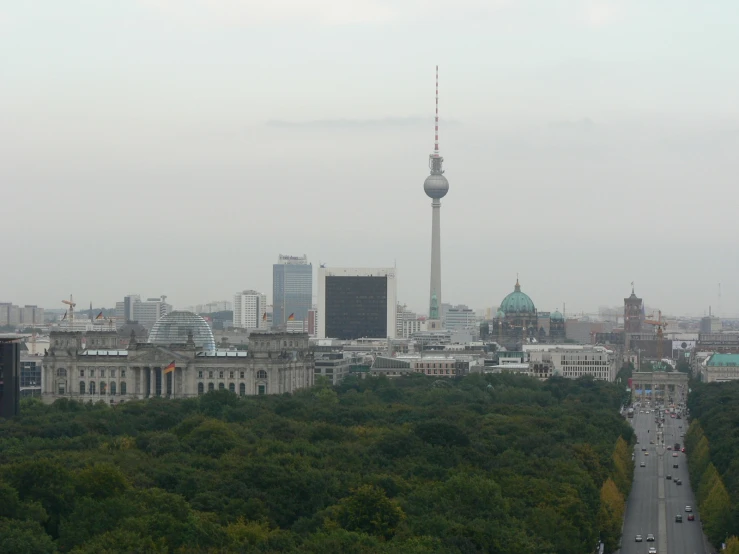 a cityscape with a tower on the other side