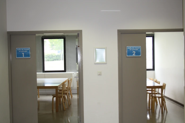 an open door leads to a dining room and kitchen