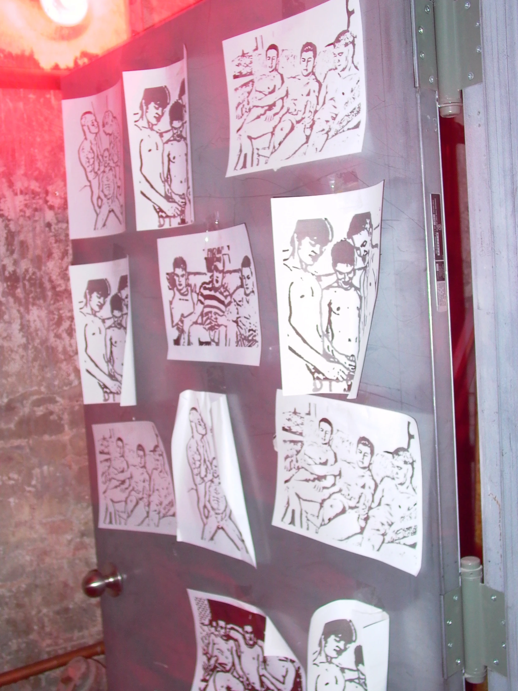 this is a door to a room with a variety of drawings on it