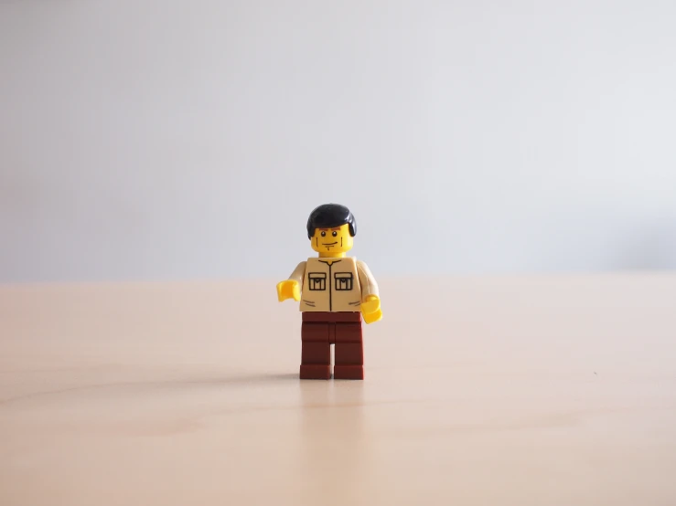 a lego man in the style of steve stark on a counter