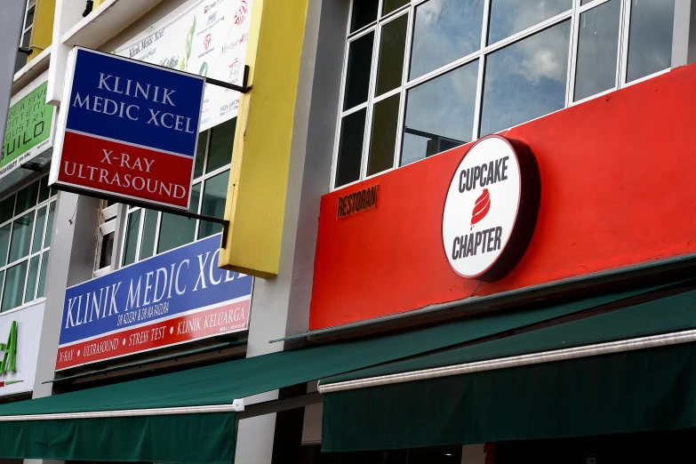 a group of signs on the side of a building