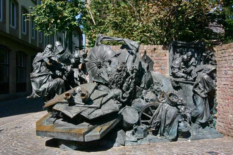 a stone monument with several sculptures on top