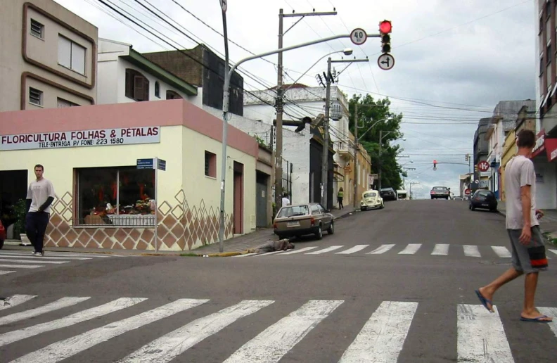 a street scene with two people and a street signal