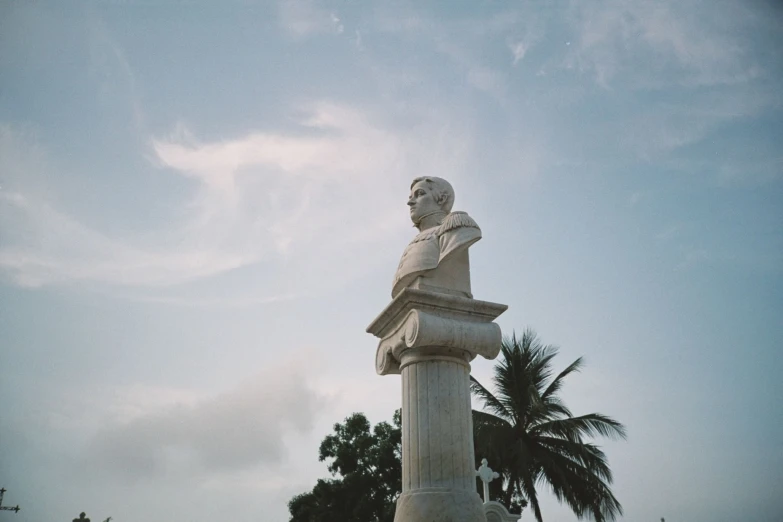 a statue of a person sitting in the background