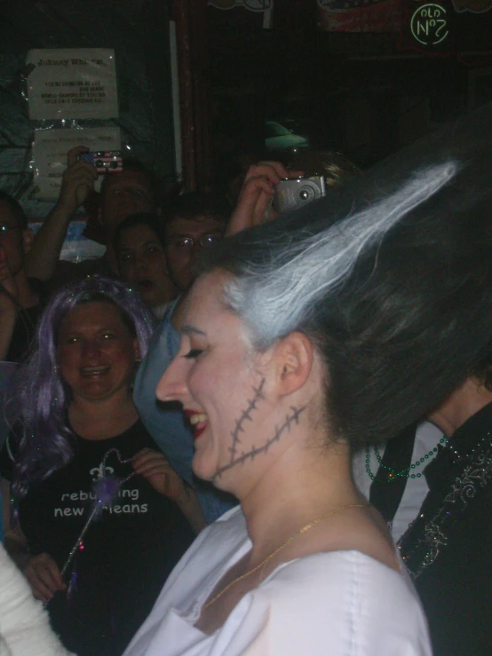 a woman with a scary face cut out from her hair