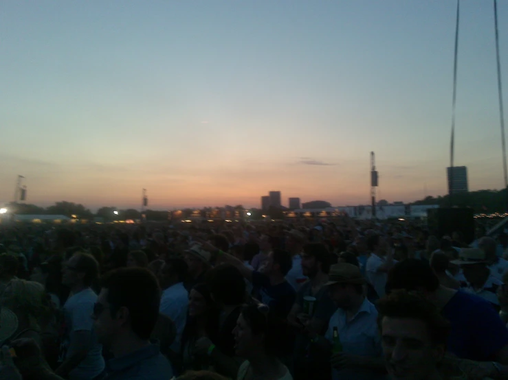 a large group of people at sunset or dawn