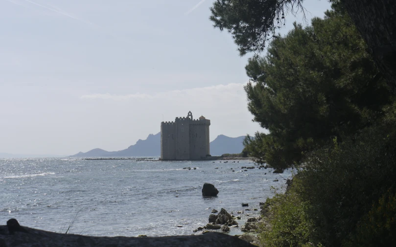 a castle on a small island surrounded by water