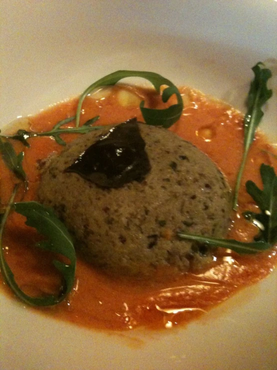 a food entree served in a bowl on a white plate