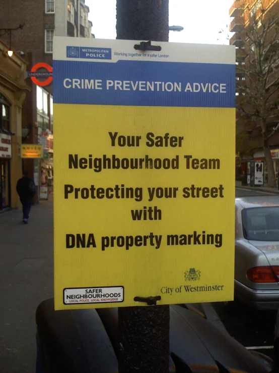 a sign on a city street saying you safe neighborhood team protecting your street with data property marking