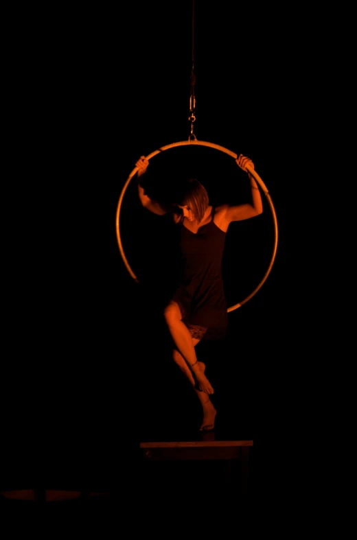 a man doing tricks on a hoop