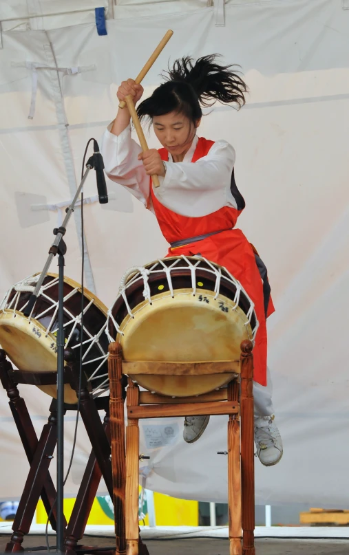 a woman playing on a musical instrument