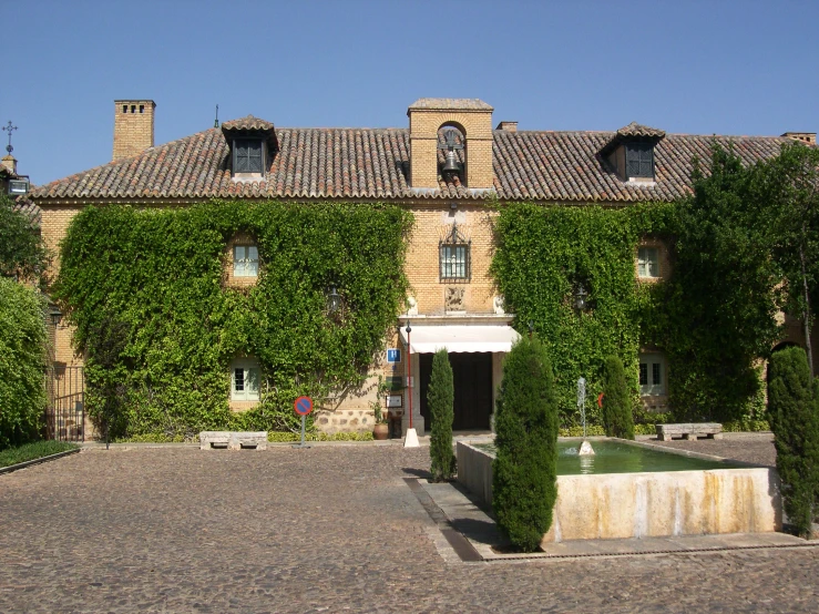 a large house with vines on the front of it