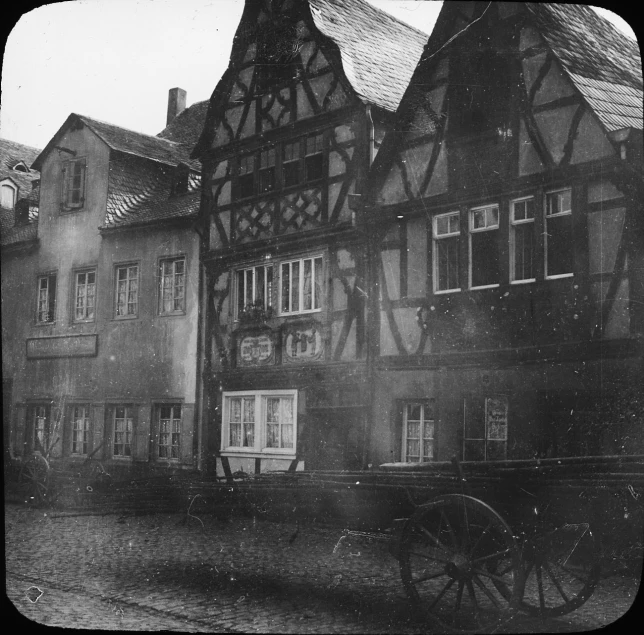 a old po with old buildings and a horse drawn cart